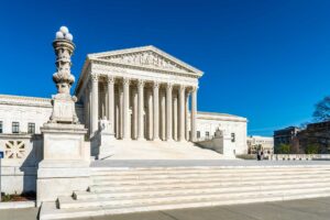 Color photo of outside view of the U.S. Supreme Court.
