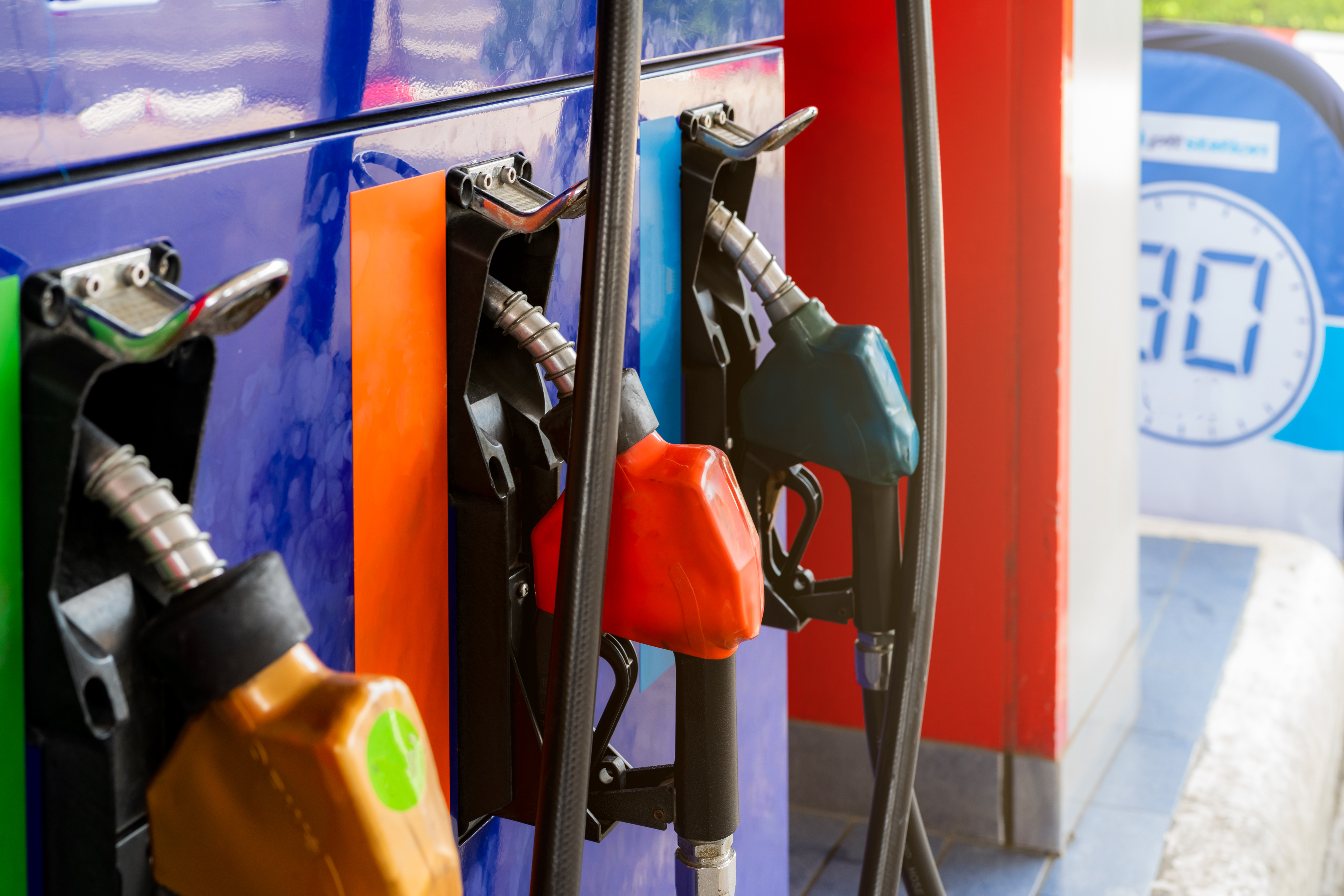 A close up of a gas pump at a station.